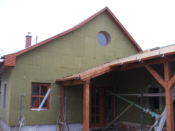 A house undergoing insulation.
