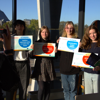 Participants holding selfie tablets