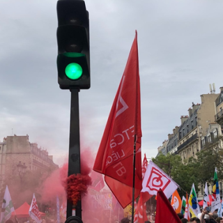 Green light at a trade union rally for fair wages and just transition